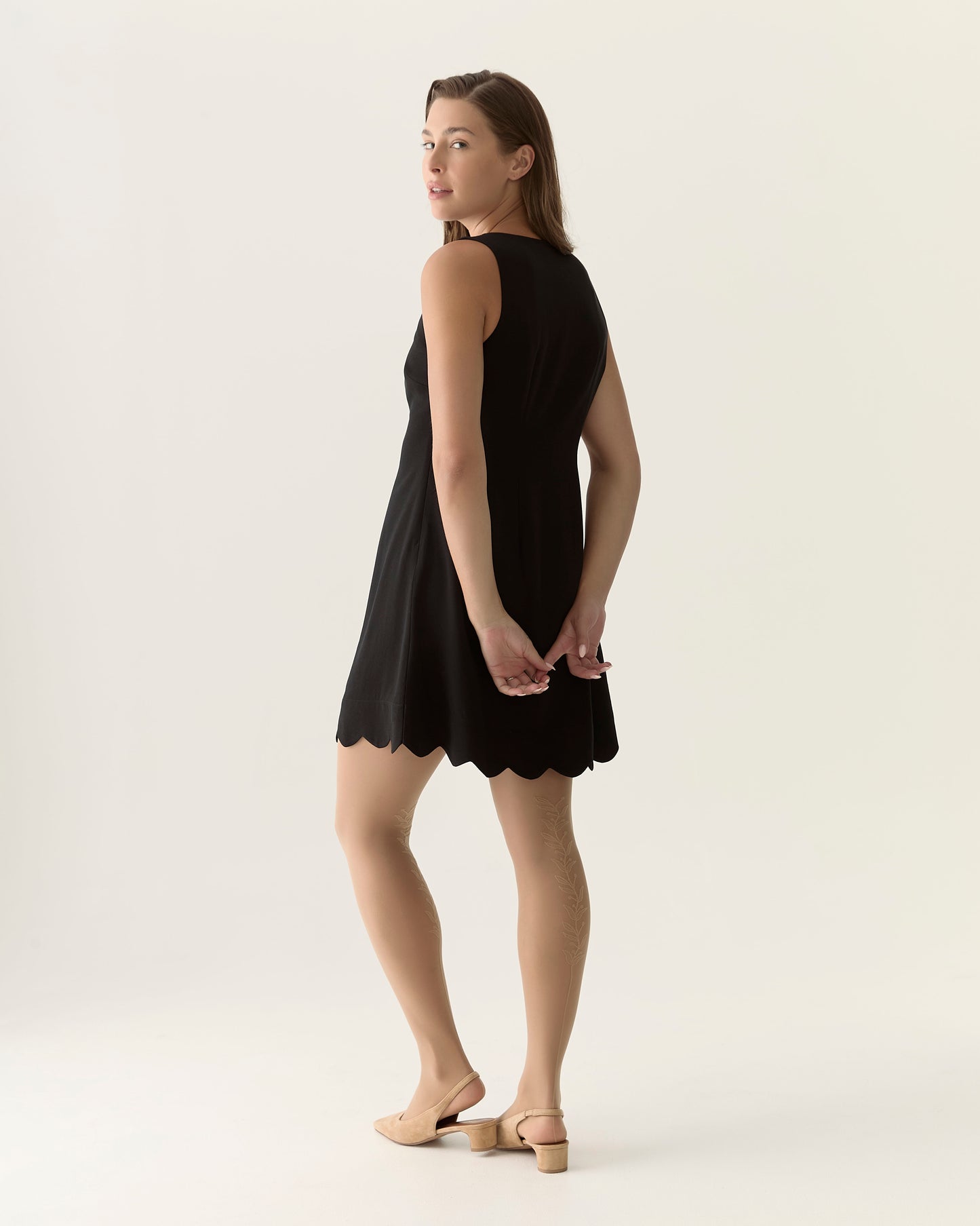 Scalloped sleeveless dress in Black