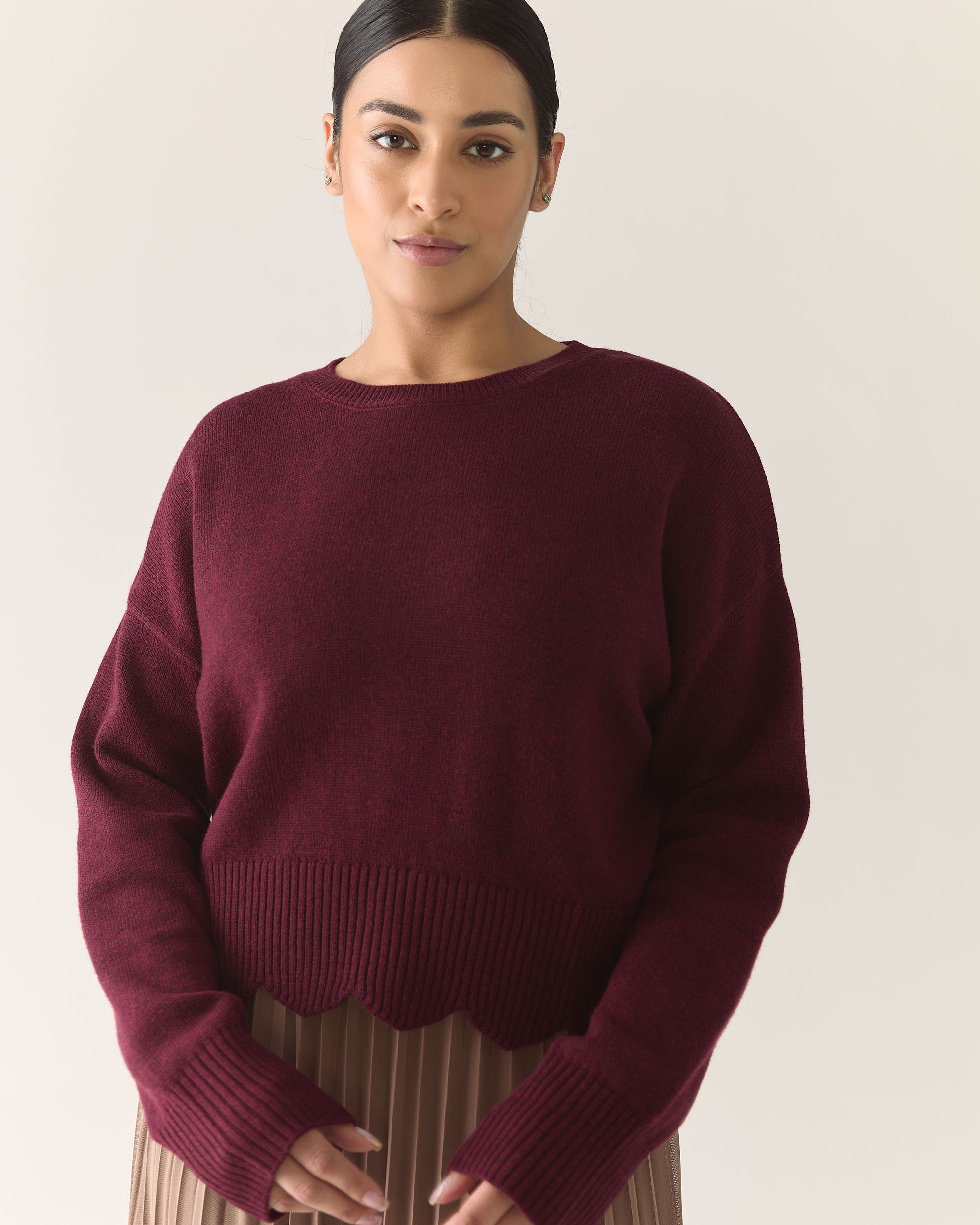 Woman wearing a burgundy sweater 